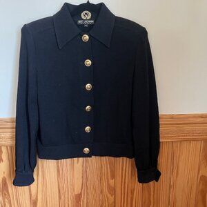 Black St. John's Knit jacket with skort - Jacket is a medium and skort is size 6